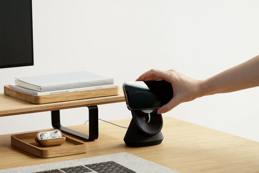 Minimalist desk setup with natural light and a plant