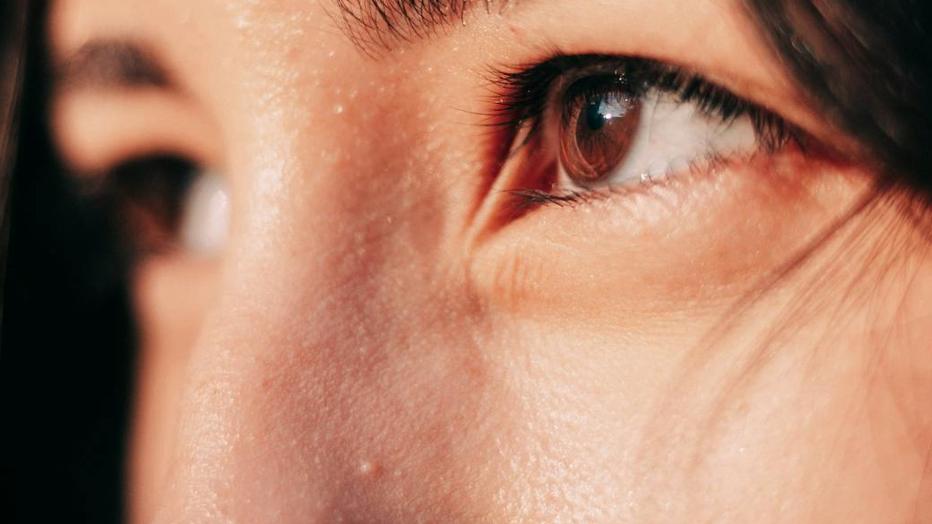 Person looking into the distance at sunset with clear eyes